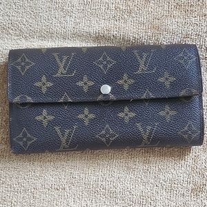 Louis Vuitton classic Sarah wallet.